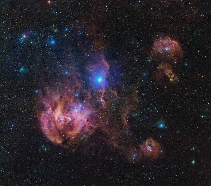 The Running Chicken Nebula comprises several clouds, all of which we can see in this vast image from the VLT Survey Telescope (VST), hosted at ESO’s Paranal site. This 1.5-billion pixel image spans an area in the sky of about 25 full Moons. The clouds shown in wispy pink plumes are full of gas and dust, illuminated by the young and hot stars within them.