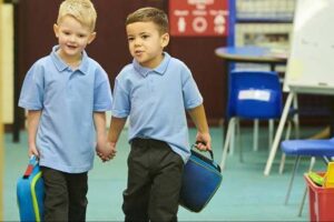 Two school boys walking together