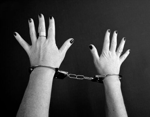 Woman's hands in handcuffs. Pixabay