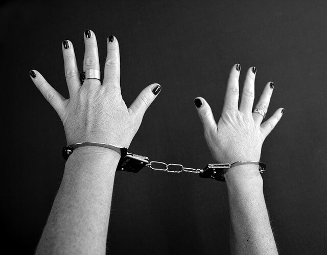 Woman's hands in handcuffs. Pixabay