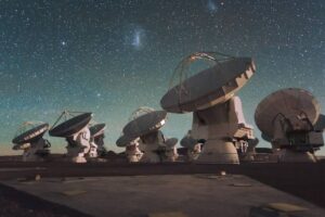 Satellite astronomy dishes pointed at the night sky