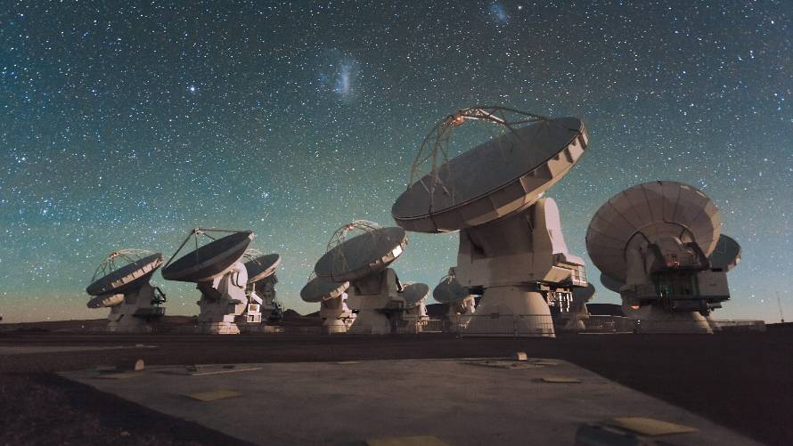 Satellite astronomy dishes pointed at the night sky