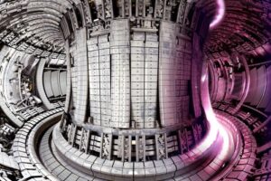 Interior of the Joint European Torus (JET) tokamak experimental fusion machine with a photo of the plasma overlaid.