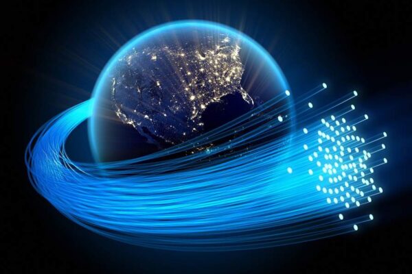 An illustration of optical fibers spinning around the globe.