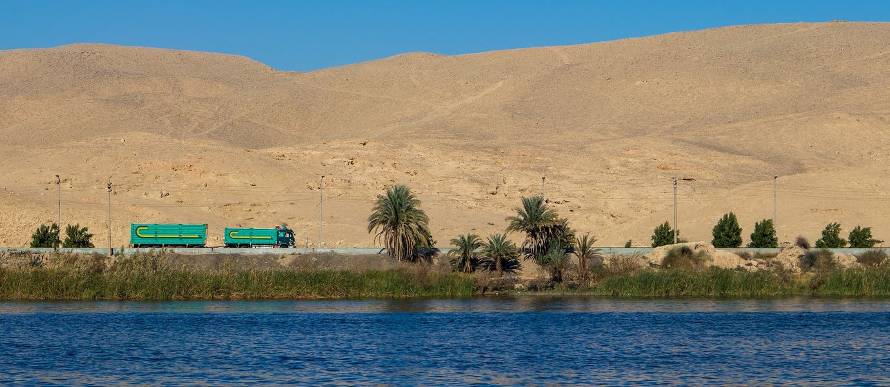 Nile river with water trucks