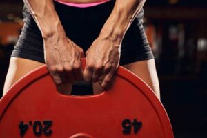 Athlete holding a weight plate