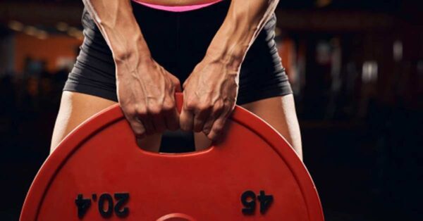 Athlete holding a weight plate