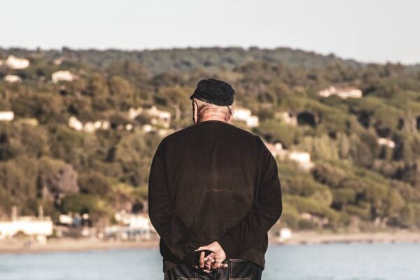 Elderly man looking at the water, s...                    </div>

                    <div class=