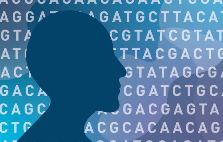 Silhouette of human head in front of DNA letters