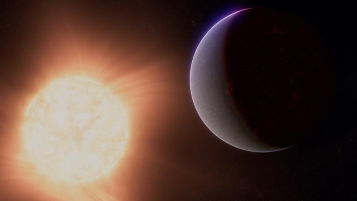 This artist's concept shows what the exoplanet 55 Cancri e could look like based on observations from NASA’s James Webb Space Telescope and other observatories. Observations from Webb’s NIRCam and MIRI suggest that the planet may be surrounded by an atmosphere rich in carbon dioxide (CO2) or carbon monoxide (CO). Researchers think the gases that make up the atmosphere could have bubbled out of an ocean of magma that is thought to cover the planet’s surface.