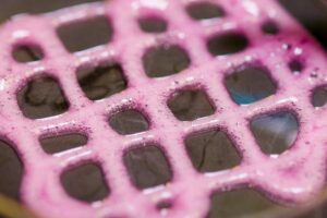 Foam containing gene therapy components is placed in a lab dish.