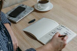 Woman filling out a healthy habits journal