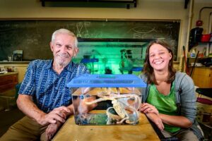 Rhanor Gillette, left, and Ekaterina Gribkova developed an AI that can navigate new environments, seek novelty and rewards, and learn in real time. Their research into the neural pathways that drive behavior in sea slugs and octopuses guided the work.