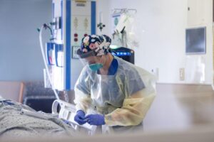 Nurse Megan Roberts cares for a COVID-19 patient in an intensive care unit at Barnes-Jewish Hospital in 2020. A study by researchers at Washington University School of Medicine in St. Louis shows that people with COVID-19 who used cannabis were more likely to be hospitalized and require intensive care than those who did not use the drug.