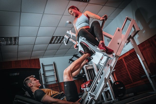 Man using leg wight machine at gym