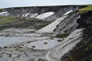 The eroding cliffs at Herschel Island. The Alfred Wegener Institute Helmholtz Center for Polar and Marine Research (AWI) commenced research in the western Canadian Arctic with the funding of the young researcher project titled Coastal Permafrost Erosion