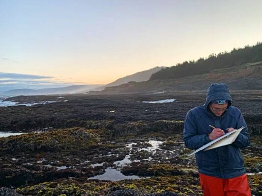 Zechariah Meunier of OSU conducts rocky shore surveys in California. Photo by Risa Askerooth.