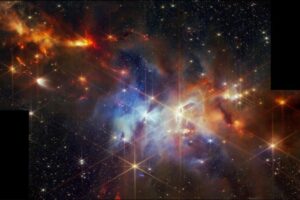 NASA's Webb telescope captures a stunning image of the Serpens Nebula, revealing a cluster of baby stars in the top left corner. These stars are still forming and shooting out powerful jets of gas in a surprising, aligned pattern. Unlike some nebulae, Serpens doesn't create its own light. Instead, it glows by reflecting light from nearby stars.