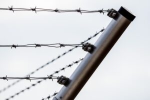 Corner of a barbed wire fence