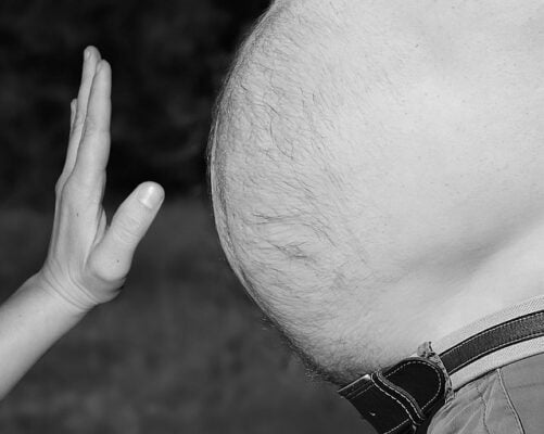Black and white image of man's big stomach