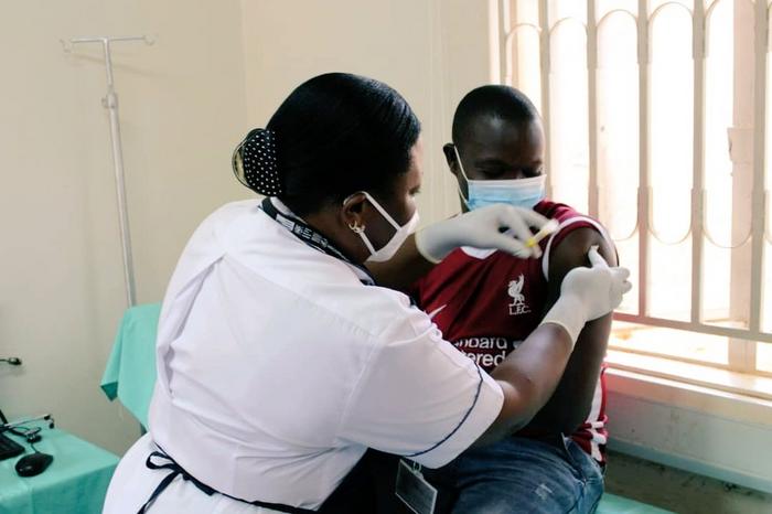 The first PrEPVacc volunteer participant receives an injection at the launch of the launch of the PrePVacc Trial at the Masaka site of the MRC/UVRI and LSHTM Uganda Research Unit, on Tuesday 15 December 2020.