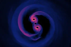 Simulation of the light emitted by a supermassive black hole binary system where the surrounding gas is optically thin (transparent). Viewed from 0 degrees inclination, or directly above the plane of the disk. The emitted light represents all wavelengths.