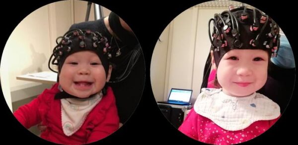 toddler wearing brain monitoring cap