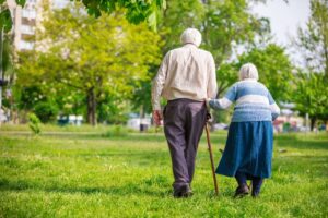 Older couple walking in a park