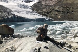 A researcher collects a sample of bedrock from the Queshque Glacier in the Peruvian Andes Mountains. The samples show tropical glaciers have retreated to their smallest size in more than 11,700 years based on cosmogenic nuclide measurements of recently exposed bedrock, an international team of scientists, led by Boston college researchers, reports in the journal Science.