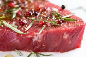 raw steak with seasoning