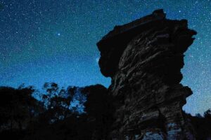 night sky with old rocks in foreground