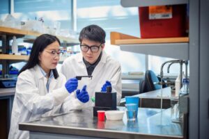 Dr. Tianxi Yang and student Peter Yang with the tool they created to test micro- and nanoplastics.