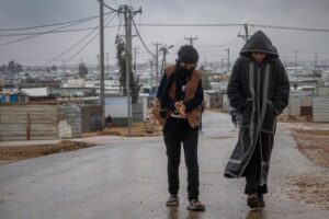 Syrian refugees walking in Jordan.