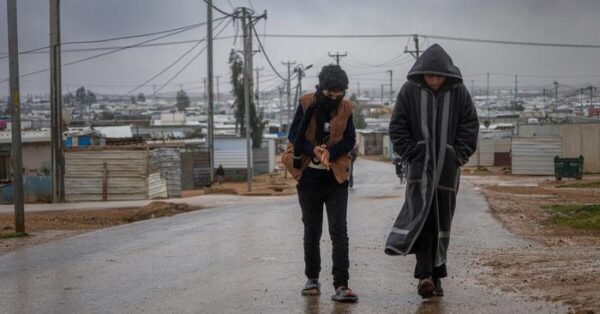 Syrian refugees walking in Jordan.