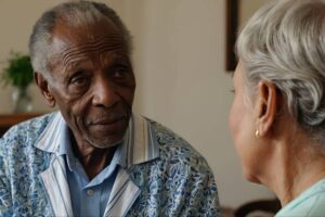 older man and woman talking