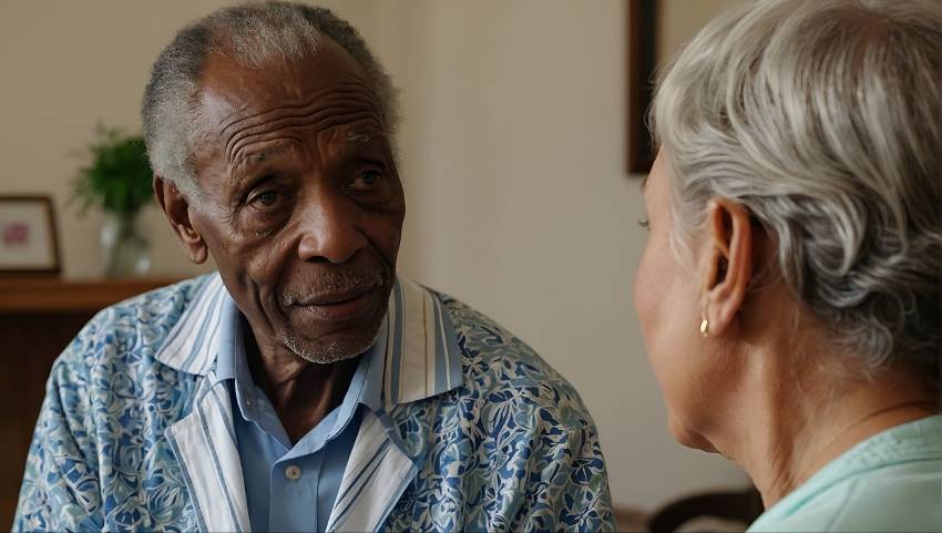 older man and woman talking