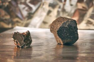 An iron meteorite from the core of a melted planetesimal (left) and a chondrite meteorite, derived from a ‘primitive’, unmelted planetesimal (right).