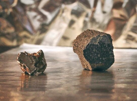 An iron meteorite from the core of a melted planetesimal (left) and a chondrite meteorite, derived from a ‘primitive...                    </div>

                    <div class=