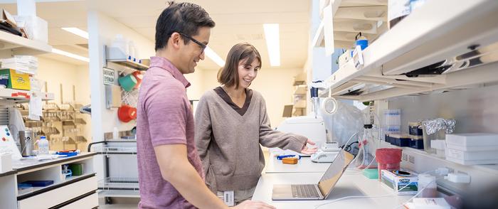 Corresponding author Dr. Evan Lien and first author Kelly Sokol in the lab at Van Andel Institute.