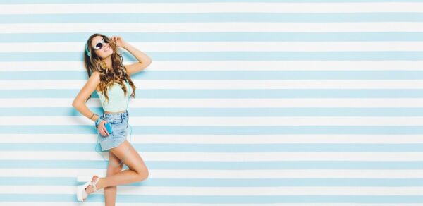 woman in denim shorts and subglasses