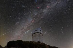 DESI observes the sky from the Mayall Telescope, shown here during the 2023 Geminid meteor shower.