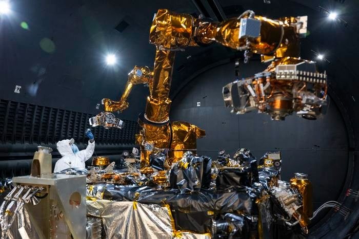 Steven Butcher, Technology Service Corporation space robotics and mechanisms engineer, performs an inspection of the Robotic Servicing of Geosynchronous Satellites (RSGS) payload after completing testing in the cryogenic thermal vacuum chamber at the U.S. Naval Research Laboratory’s Naval Center for Space Technology in Washington, D.C. Oct. 4, 2024. Once on-orbit, the RSGS payload will inspect and service satellites in geosynchronous orbit.