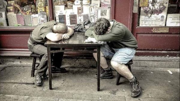 Two lads napping at the pub