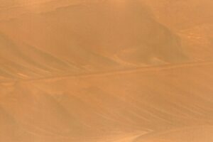 NASA’s Ingenuity Mars Helicopter, right, stands near the apex of a sand ripple in an image taken by Perseverance on Feb. 24, 2024, about five weeks after the rotorcraft’s final flight. Part of one of Ingenuity’s rotor blades lies on the surface about 49 feet (15 meters) west of helicopter (at left in image). Credit: NASA/JPL-Caltech/LANL/CNES/CNRS