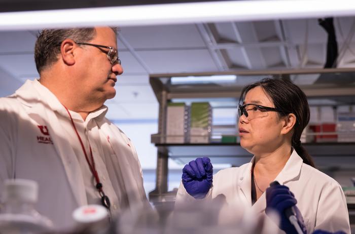 Robin Shaw, MD, PhD (left) and TingTing Hong, MD, PhD (right) at the lab bench.