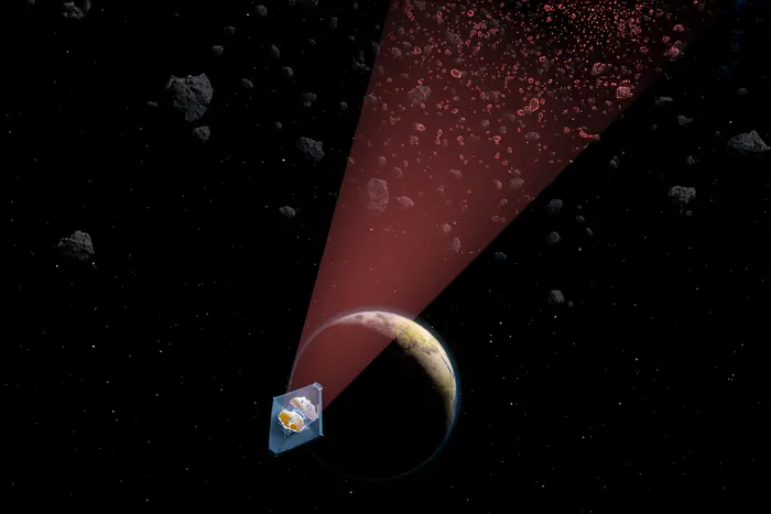 An artist’s illustration of NASA’s James Webb Space Telescope revealing a population of small asteroids in the main asteroid belt.