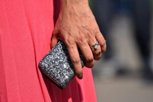 woman's hand gripping a cell phone