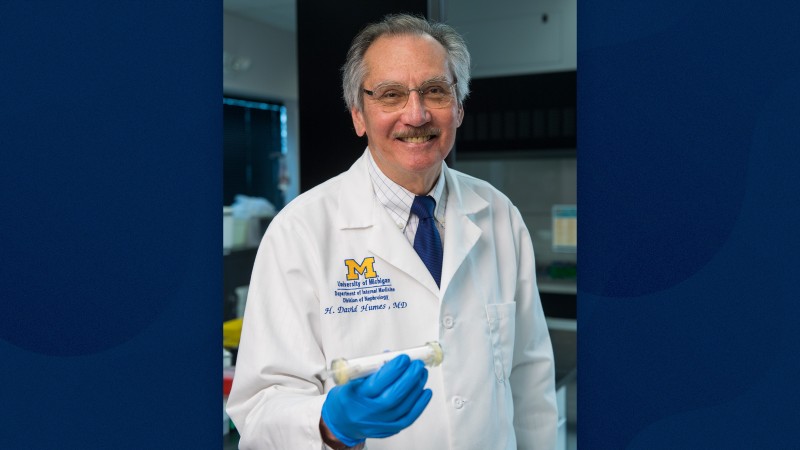 Humes holding a prototype of the Selective Cytopheretic Device developed to treat smaller pediatric patients.