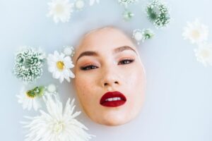 woman's Asian face in milky water