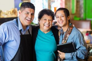 Latino man and two Latina women
